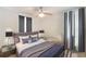Stylish bedroom featuring neutral tones, modern furnishings, and abundant natural light at 1221 E Hamilton Ave, Tampa, FL 33604