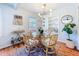 Bright dining room featuring a stylish chandelier, modern decor, and a glass-top table at 1221 E Hamilton Ave, Tampa, FL 33604