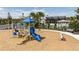 Community playground with slide, play structure, and surrounding green space at 12320 49Th E St, Parrish, FL 34219