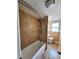 Bathroom featuring a shower and bathtub with tan tile and white fixtures at 12907 N 53Rd St, Temple Terrace, FL 33617