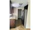 Well-equipped kitchen with stainless steel appliances, sleek counters and nearby laundry at 12907 N 53Rd St, Temple Terrace, FL 33617