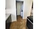 Convenient laundry area with a stacked washer and dryer setup in the kitchen at 12907 N 53Rd St, Temple Terrace, FL 33617