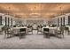 Expansive banquet hall with round tables, comfortable seating and elegant chandeliers at 12961 Shining Blue Nile Ln, Parrish, FL 34219