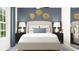 Well-decorated bedroom with a comfortable bed, modern lamps, and stylish wall decor at 12961 Shining Blue Nile Ln, Parrish, FL 34219