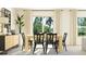 Bright dining room with natural light, modern furniture, and stylish decor at 12961 Shining Blue Nile Ln, Parrish, FL 34219