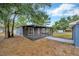 The backyard featuring a covered patio, mature tree, and lots of space at 1304 N Ferrell St, Plant City, FL 33563