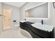 Modern bathroom with double vanity, sleek design, and walk-in shower at 1304 N Ferrell St, Plant City, FL 33563