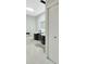 Bathroom featuring modern vanity with sleek design, bright lights, and tiled floors at 1304 N Ferrell St, Plant City, FL 33563