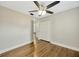This bedroom includes hardwood floors, a ceiling fan, and closet space at 1304 N Ferrell St, Plant City, FL 33563