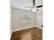 This is a cozy bedroom with hardwood floors and a bright window view at 1304 N Ferrell St, Plant City, FL 33563