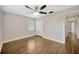 The bedroom provides hardwood floors, a ceiling fan, and closet space at 1304 N Ferrell St, Plant City, FL 33563