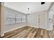 Bright dining room with updated floors, natural light, and an open doorway to the kitchen at 1304 N Ferrell St, Plant City, FL 33563