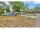 Single-Gathering home with a long driveway, mature trees, and a mailbox at 1304 N Ferrell St, Plant City, FL 33563