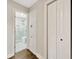 Hallway with view into renovated bathroom with glass shower and modern fixtures at 1304 N Ferrell St, Plant City, FL 33563