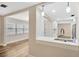 Open-concept kitchen featuring quartz countertops and a stainless steel sink overlooking the dining area at 1304 N Ferrell St, Plant City, FL 33563