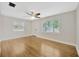 Bright living room features hardwood floors, neutral paint, and a ceiling fan at 1304 N Ferrell St, Plant City, FL 33563