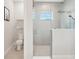 This bathroom features a glass-enclosed shower and separate water closet at 13098 Wellspring Dr, Lithia, FL 33547