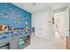 This bedroom features fun colorful wall decor, and a playful design at 13098 Wellspring Dr, Lithia, FL 33547