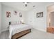 This bedroom features a minimalist design, a ceiling fan, and built in closet at 13098 Wellspring Dr, Lithia, FL 33547