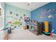 This bedroom features fun colorful wall decor, and a playful design at 13098 Wellspring Dr, Lithia, FL 33547