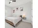 This bedroom features a modern design, a ceiling fan, and minimalist decor at 13098 Wellspring Dr, Lithia, FL 33547