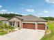 Charming single-Gathering home with a stone facade, two-car garage, and well-maintained landscaping at 13098 Wellspring Dr, Lithia, FL 33547
