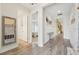 Hallway with wood floors leading to the main bedroom, bathroom and kitchen area at 13098 Wellspring Dr, Lithia, FL 33547