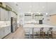 Spacious kitchen with an oversized island, stainless steel refrigerator, and lots of cabinet space at 13098 Wellspring Dr, Lithia, FL 33547