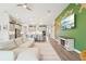 A bright living room that opens into a large modern kitchen and dining area at 13098 Wellspring Dr, Lithia, FL 33547