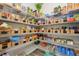 Organized walk-in pantry with wire shelving and neatly arranged baskets filled with food at 13098 Wellspring Dr, Lithia, FL 33547