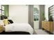 Bright bedroom featuring modern decor and a comfortable bed with stylish throw pillows at 13123 Empress Jewel Trl, Parrish, FL 34219