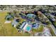 Aerial view shows a community center including pool, playground, pond and tennis and volleyball courts, with parking at 13201 Wellington Hills Dr, Riverview, FL 33579