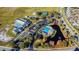 Community baseball and tennis fields and the pool surrounded by pond and trees at 13201 Wellington Hills Dr, Riverview, FL 33579