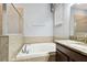 Bright bathroom with a soaking tub, tiled shower, and granite countertops at 13201 Wellington Hills Dr, Riverview, FL 33579
