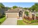 Beautiful single-Gathering home featuring a two-car garage, landscaped yard, and well-maintained lawn at 13201 Wellington Hills Dr, Riverview, FL 33579