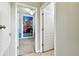 Hallway leading into a bedroom with a large ocean themed wall graphic at 13201 Wellington Hills Dr, Riverview, FL 33579