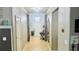 Welcoming hallway with tile flooring, stylish decor, and ample natural light provides a great first impression at 13201 Wellington Hills Dr, Riverview, FL 33579