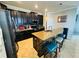 Kitchen with dark cabinets, granite countertops, stainless steel fridge with screen, and tile backsplash at 13201 Wellington Hills Dr, Riverview, FL 33579