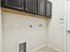Well-equipped laundry room with upper cabinets and tiled floors, ready for appliances at 13201 Wellington Hills Dr, Riverview, FL 33579