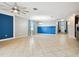 Expansive living space with tile flooring, ample room for entertaining, and neutral walls at 13201 Wellington Hills Dr, Riverview, FL 33579