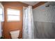 The bathroom features decorative tile shower with modern fixtures and natural light at 1394 Stonehenge Way, Palm Harbor, FL 34683