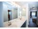 This bathroom offers a double sink vanity and is conveniently located near the main bedroom at 1394 Stonehenge Way, Palm Harbor, FL 34683