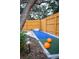 Outdoor bowling alley next to a putting green, perfect for backyard entertainment at 1394 Stonehenge Way, Palm Harbor, FL 34683