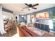 Open-concept living area with comfortable seating, modern decor, and seamless flow to the kitchen and dining area at 1394 Stonehenge Way, Palm Harbor, FL 34683