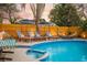 Outdoor lounge area with a pool, hammocks, and sun loungers at 1394 Stonehenge Way, Palm Harbor, FL 34683