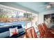 Inviting screened porch overlooking pool and fenced backyard, perfect for relaxing or entertaining at 1394 Stonehenge Way, Palm Harbor, FL 34683