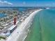 Condominium aerial view of beach access, swimming pool and views at 14300 Gulf Blvd # 401, Madeira Beach, FL 33708