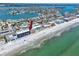 Aerial shot showcasing condo by the beach with swimming pool, beach access, and water views at 14300 Gulf Blvd # 401, Madeira Beach, FL 33708