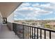 Condo balcony view showing the city skyline and street with blue skies in the background at 14300 Gulf Blvd # 401, Madeira Beach, FL 33708