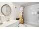 Clean bathroom with new shower and tub, vanity, modern fixtures and decor at 14300 Gulf Blvd # 401, Madeira Beach, FL 33708